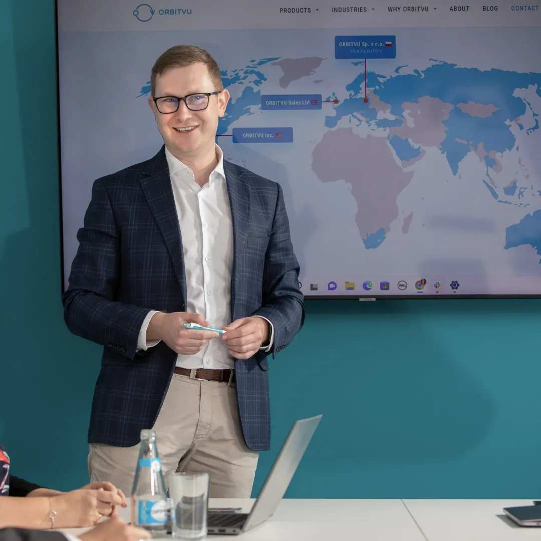 Business Executive Presenting Global Strategy with World Map Display